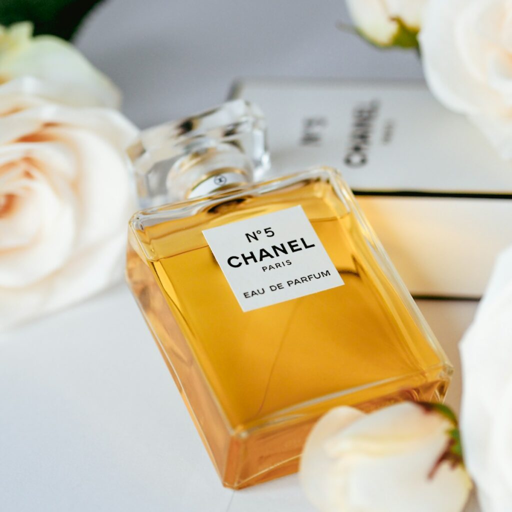 a bottle of perfume sitting on top of a table